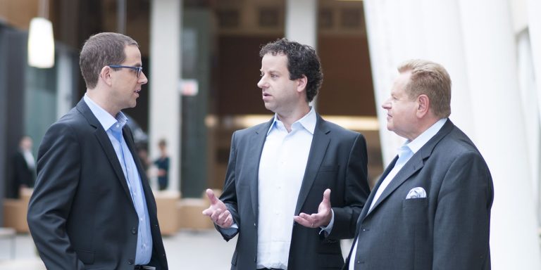 Toronto's dedicated accident and injury lawyers in a collaborative moment, epitomizing the client-focused approach of their personal injury law practice